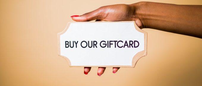 person holding sign on a plaque